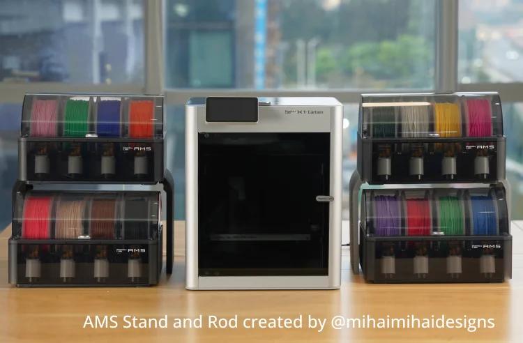 Stacked Bambu Lab AMS units next to a printer